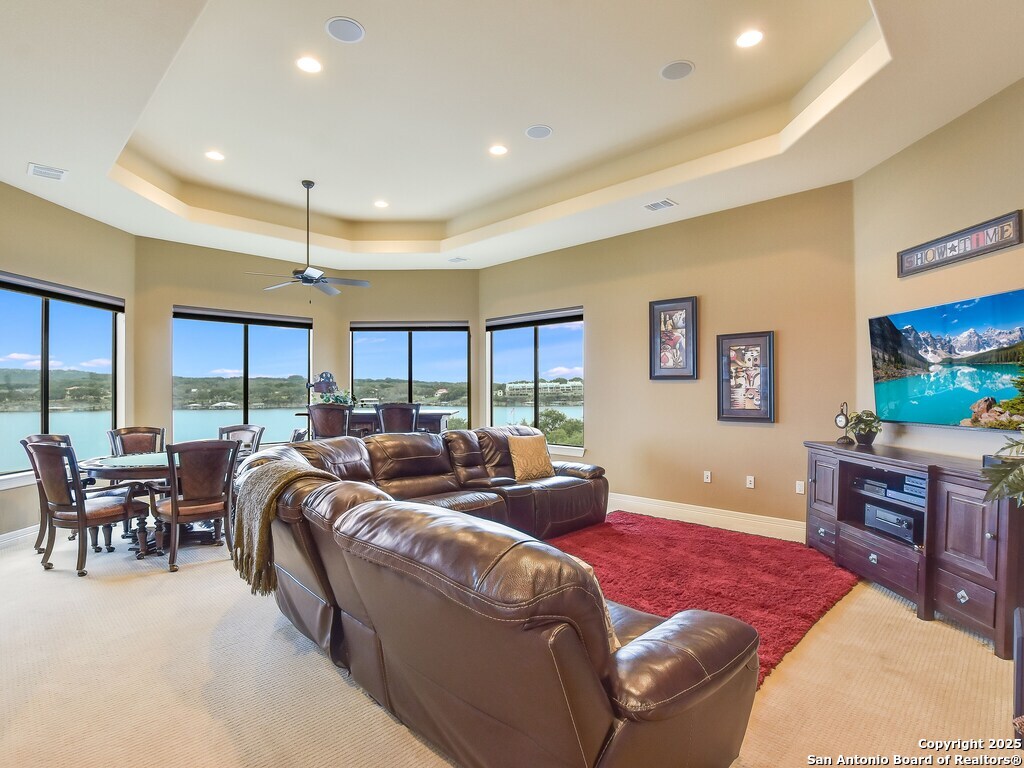 21913 Mockingbird Street Lago Vista, TX 78645 - Photo 21 of 39 a living room with furniture and a flat screen tv