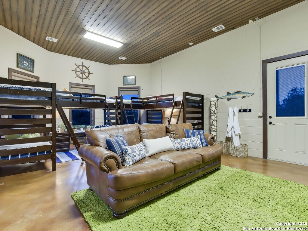 21913 Mockingbird Street Lago Vista, TX 78645 - Photo 25 of 39 a living room with furniture and a flat screen tv