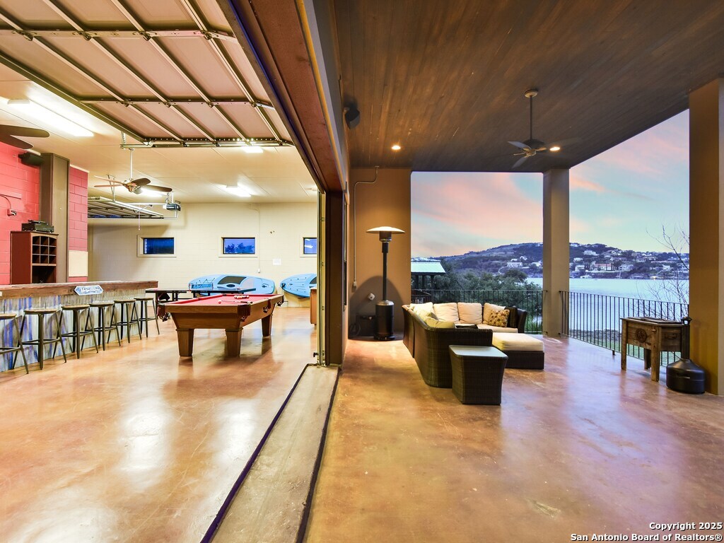 21913 Mockingbird Street Lago Vista, TX 78645 - Photo 26 of 39 a lobby with furniture and a floor to ceiling window