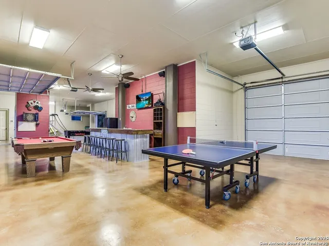 a room with lots of furniture and tables