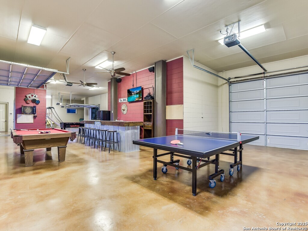 21913 Mockingbird Street Lago Vista, TX 78645 - Photo 32 of 39 a room with lots of furniture and tables