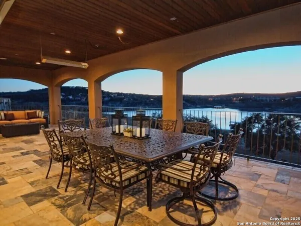 a view of a dinning table and chairs in the patio