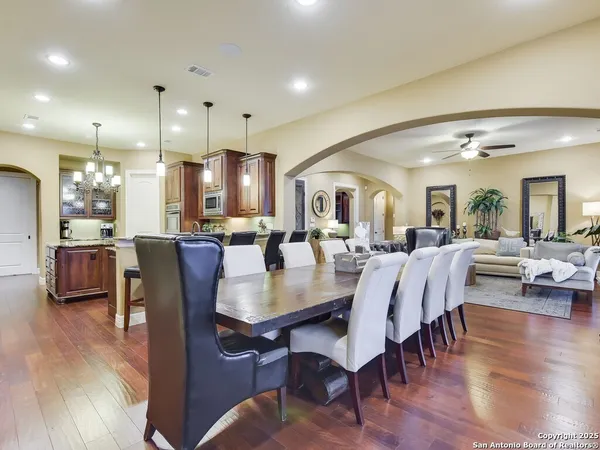 a view of a dining area with furniture and wooden floor