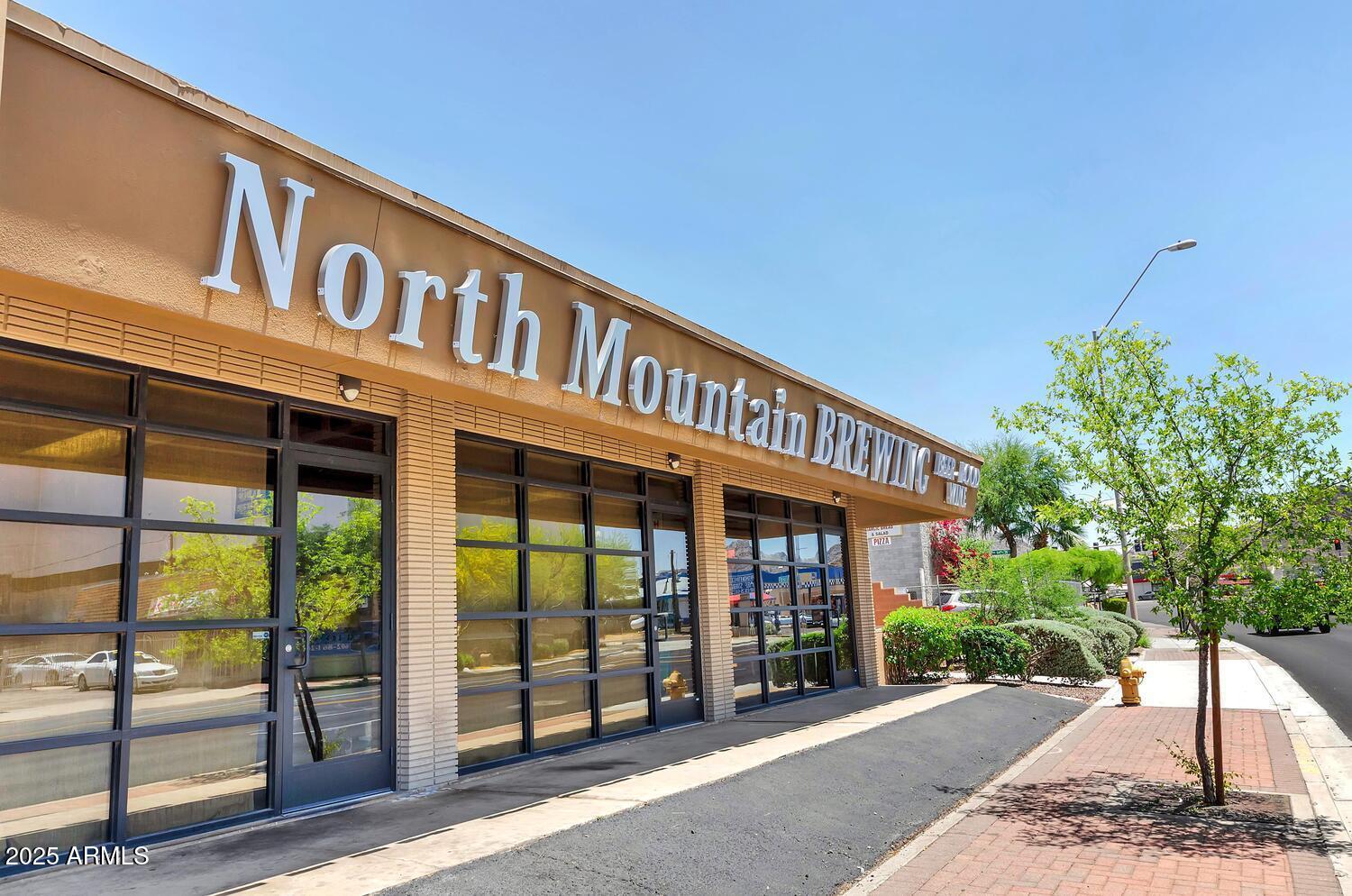 822 East Carol Avenue Phoenix, AZ 85020 - Photo 24 of 25 a front view of a building with garden