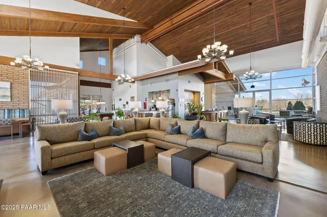 a view of a dining room with furniture and window