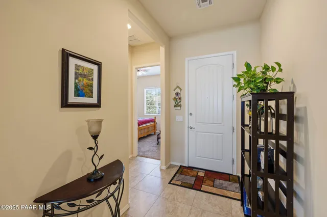 a kitchen with stainless steel appliances a refrigerator and a stove top oven