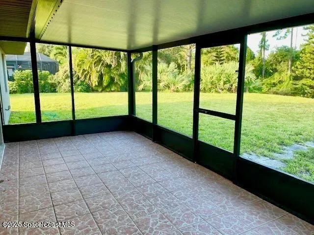 a view of lot of an empty room with a large window