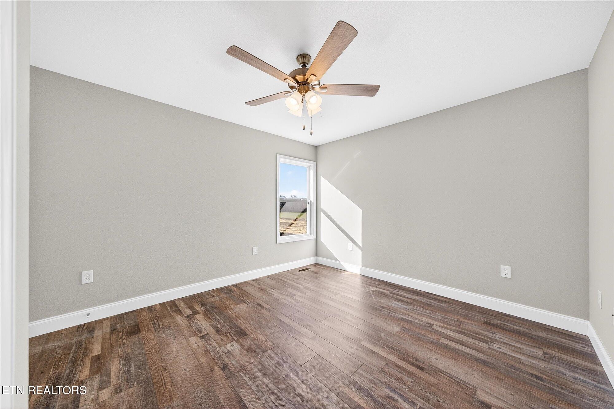 1311 Cook Road Crossville, TN 38555 - Photo 14 of 32 a view of a room with wooden floor and white walls