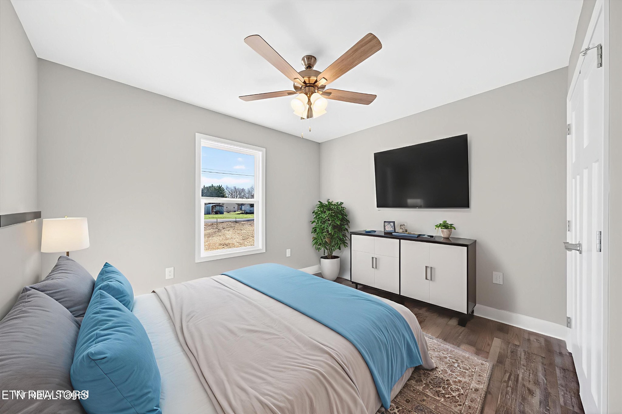 1311 Cook Road Crossville, TN 38555 - Photo 17 of 32 a bedroom with a large bed and a flat screen tv