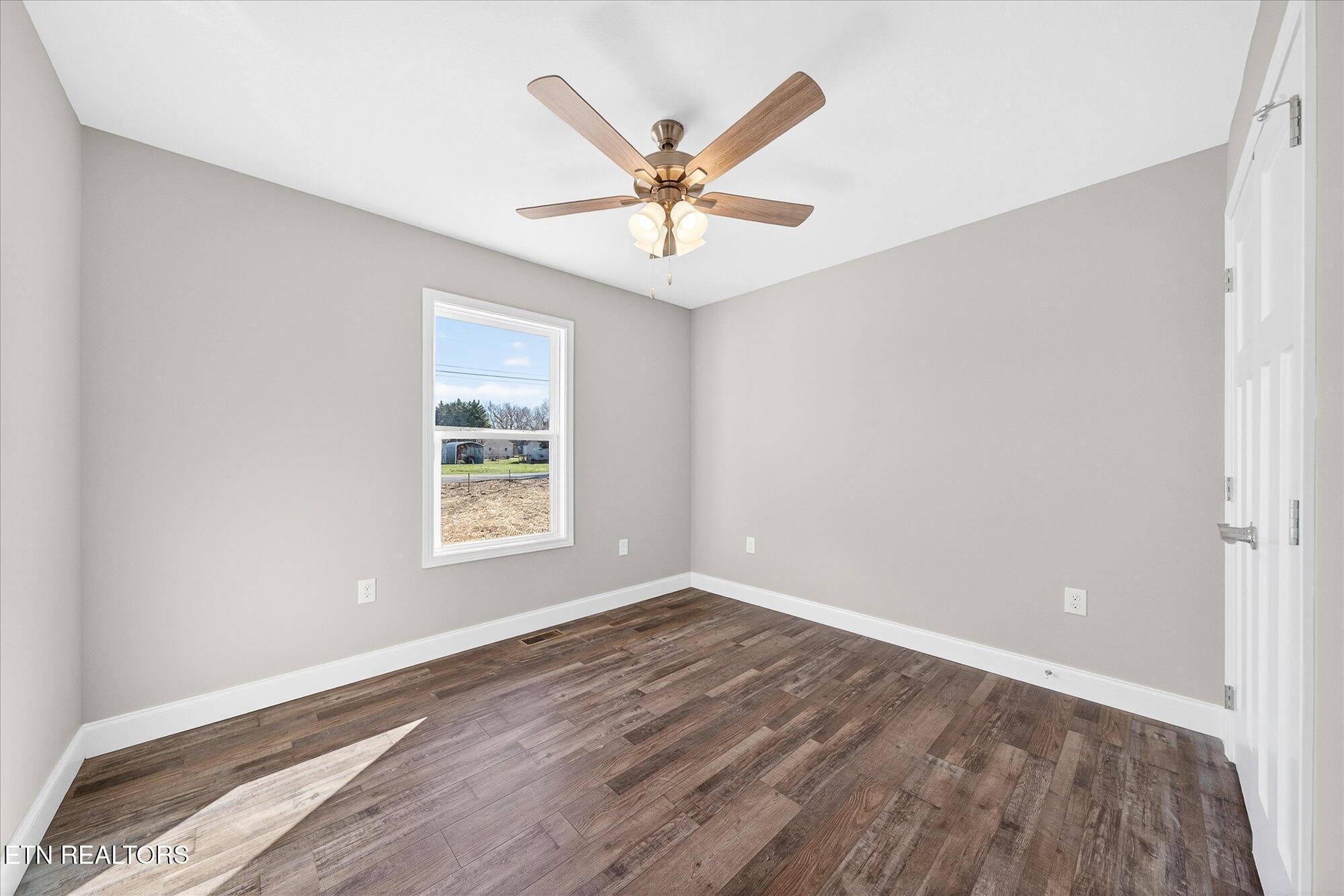 1311 Cook Road Crossville, TN 38555 - Photo 18 of 32 a view of a livingroom with a window and a ceiling fan