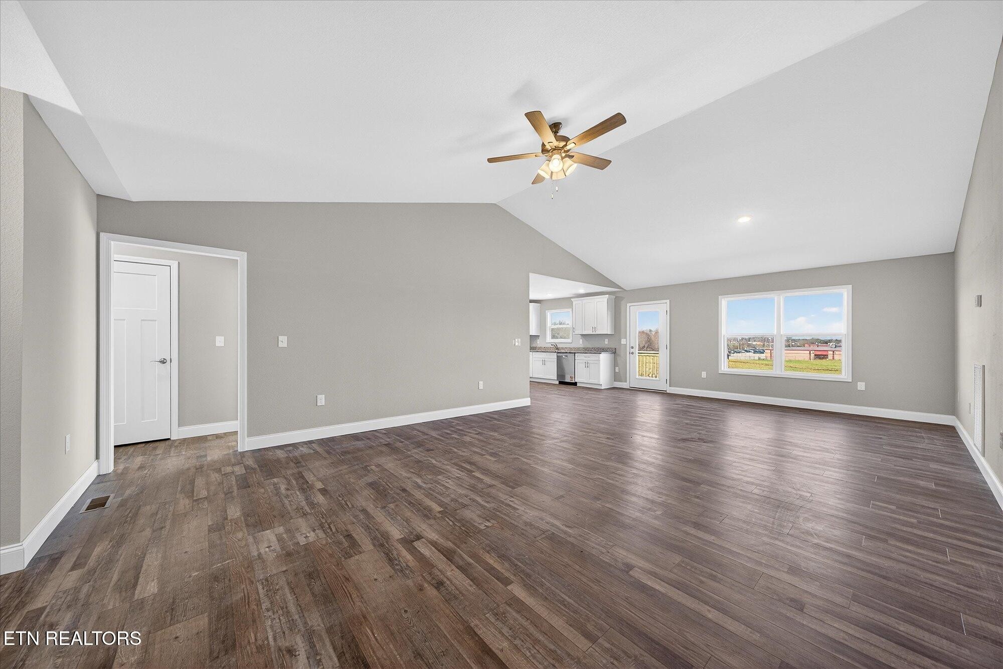 1311 Cook Road Crossville, TN 38555 - Photo 5 of 32 a view of an empty room with wooden floor and a window