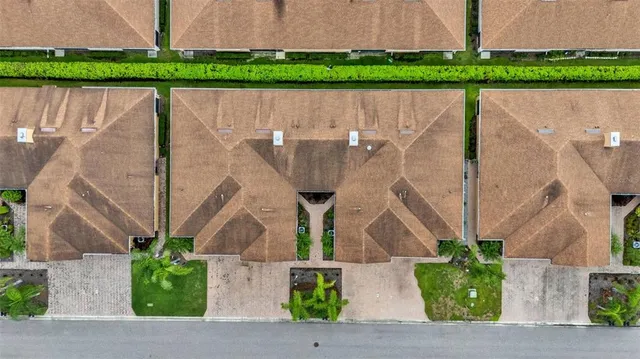 a aerial view of a house with a garden and plants