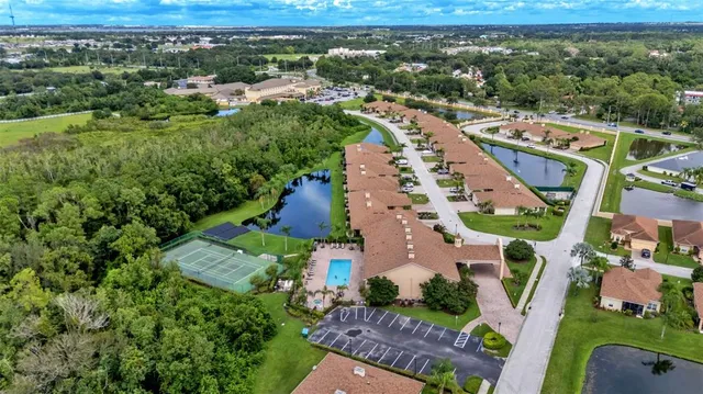 an aerial view of residential houses with outdoor space