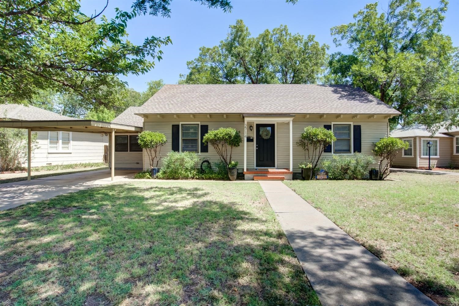 front view of a house with a yard