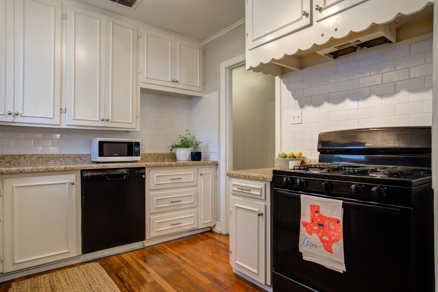 2714 29th Street Lubbock, TX 79410 - Photo 11 of 35 a kitchen with stainless steel appliances a stove and a refrigerator