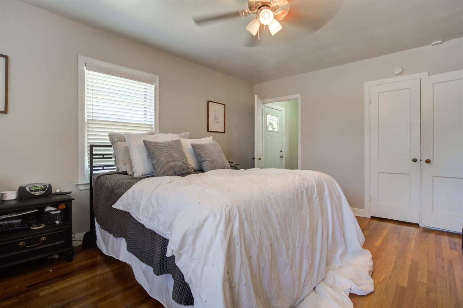 2714 29th Street Lubbock, TX 79410 - Photo 15 of 35 a bedroom with a bed and wooden floor