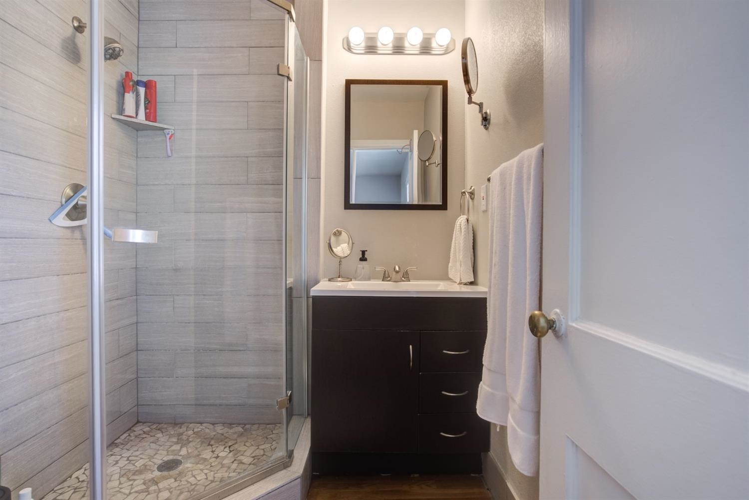 2714 29th Street Lubbock, TX 79410 - Photo 16 of 35 a bathroom with a sink and a mirror