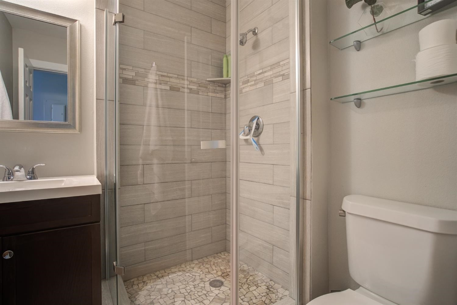 2714 29th Street Lubbock, TX 79410 - Photo 20 of 35 a bathroom with a shower a toilet and sink