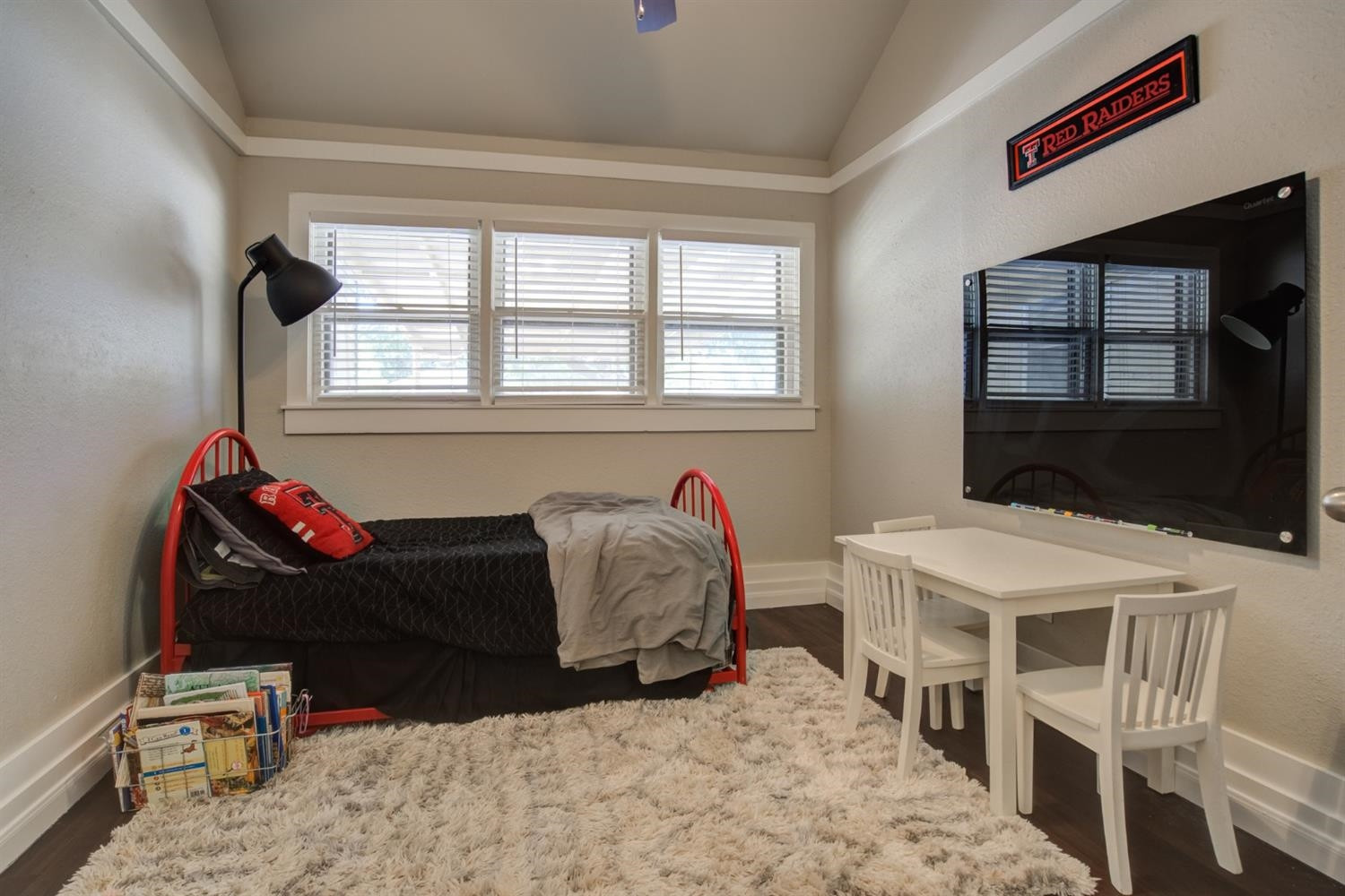 2714 29th Street Lubbock, TX 79410 - Photo 21 of 35 a living room with furniture a flat screen tv and a window