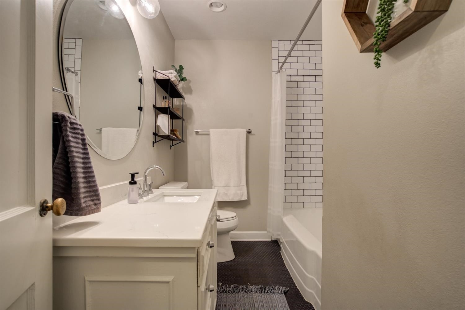 2714 29th Street Lubbock, TX 79410 - Photo 23 of 35 a bathroom with a sink a toilet and shower