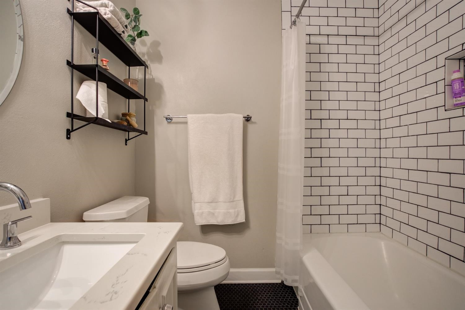 2714 29th Street Lubbock, TX 79410 - Photo 24 of 35 a bathroom with a sink a toilet and shower