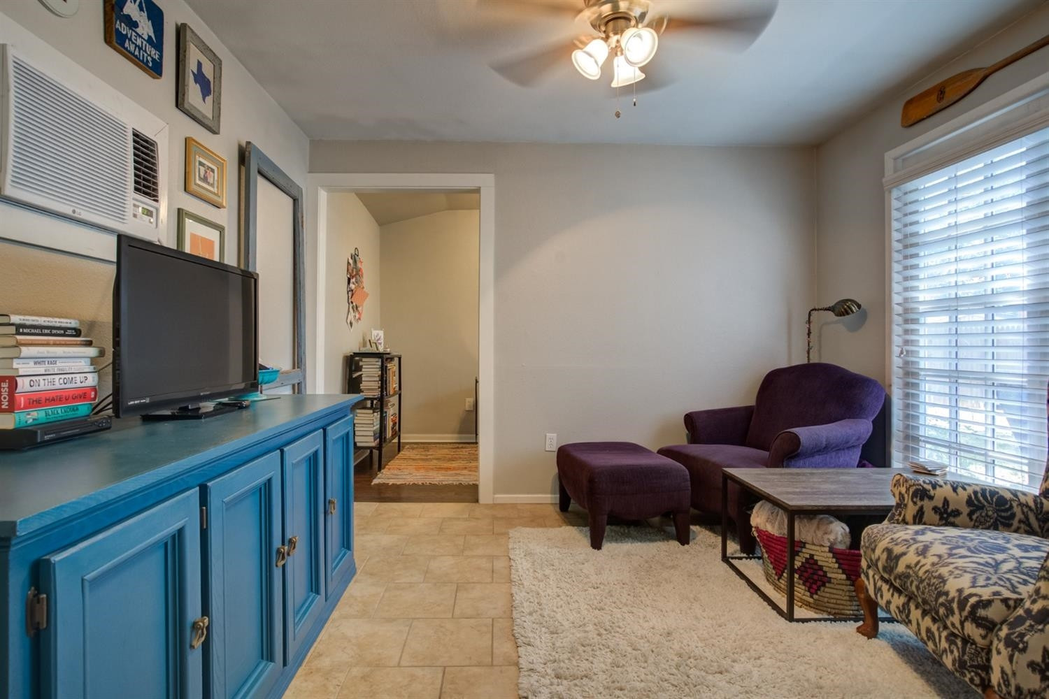 2714 29th Street Lubbock, TX 79410 - Photo 28 of 35 a living room with furniture and a flat screen tv
