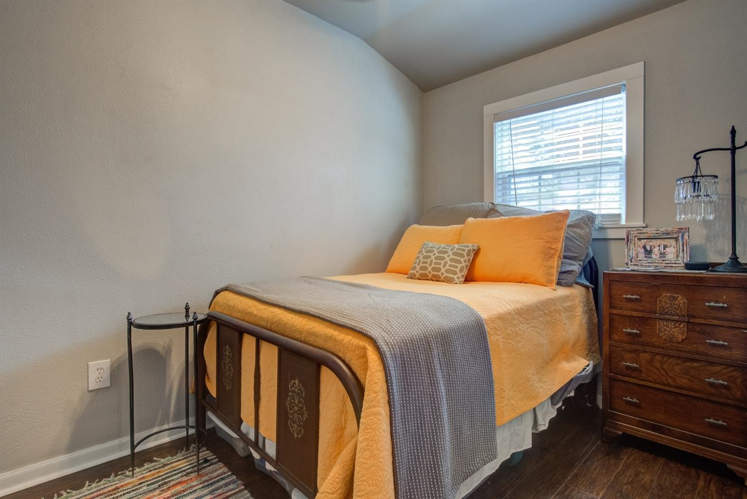 2714 29th Street Lubbock, TX 79410 - Photo 30 of 35 a bedroom with a bed and wooden floor