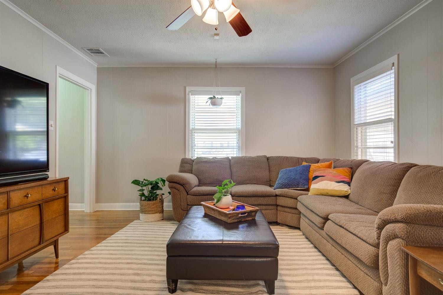 2714 29th Street Lubbock, TX 79410 - Photo 6 of 35 a living room with furniture and a flat screen tv
