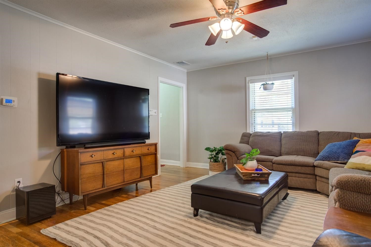 2714 29th Street Lubbock, TX 79410 - Photo 7 of 35 a living room with furniture and a flat screen tv