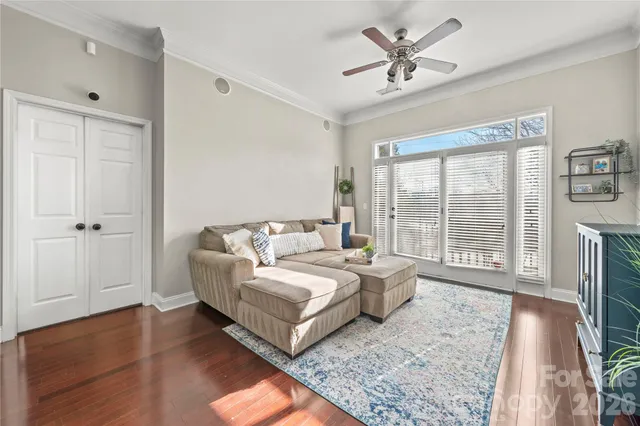 a spacious bedroom with a bed and a large window with outer view