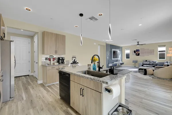 a very nice looking living room with furniture and a wooden floor