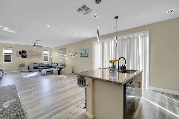 a kitchen with granite countertop cabinets stainless steel appliances and sink