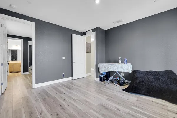 a bedroom with a bed and a couch