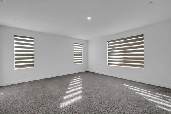 a view of a room with a window and a kitchen