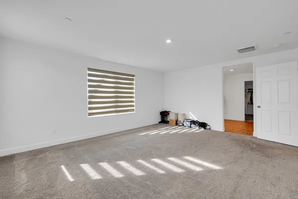 a view of empty room with windows