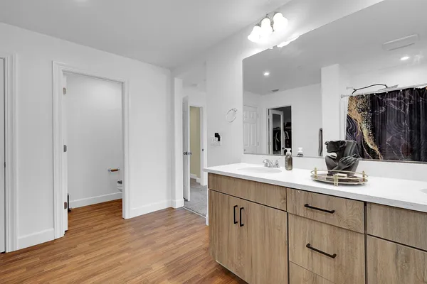 a view of walk in closet with clothes