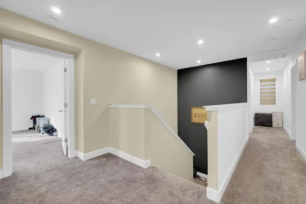 a bedroom with a bed and a lamp