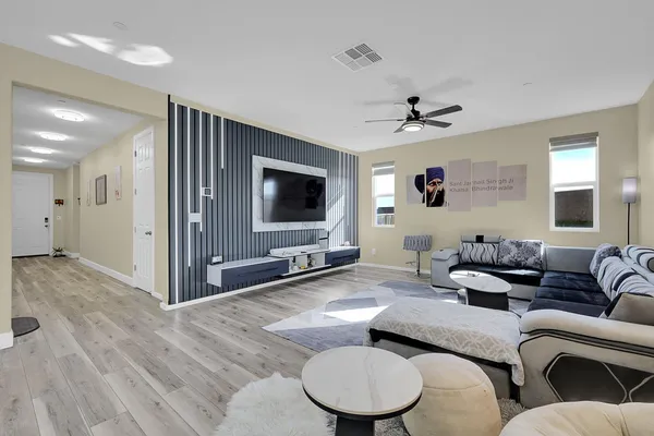 a living room with furniture or couch and a wooden floor