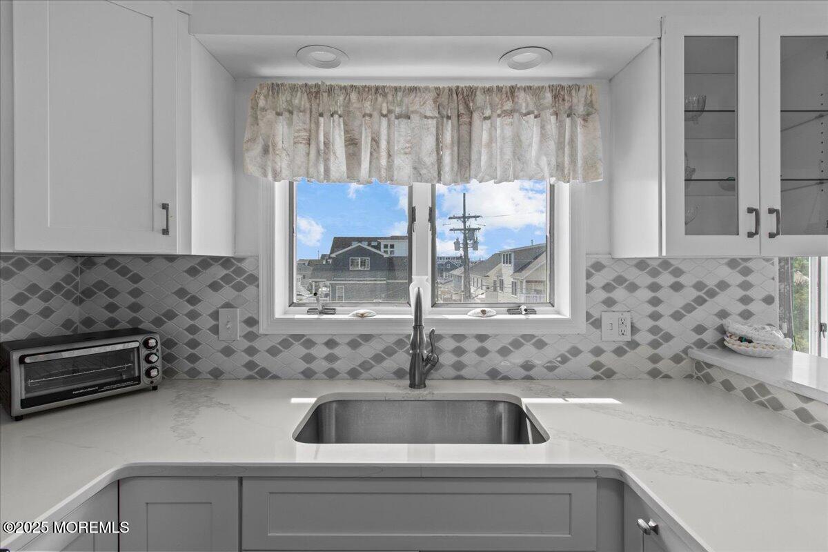 30 Dune Terrace Seaside Heights, NJ 08751 - Photo 11 of 42 a kitchen with a sink and a stove top oven