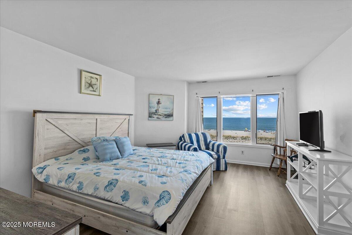 30 Dune Terrace Seaside Heights, NJ 08751 - Photo 17 of 42 a bedroom with a bed and glass door