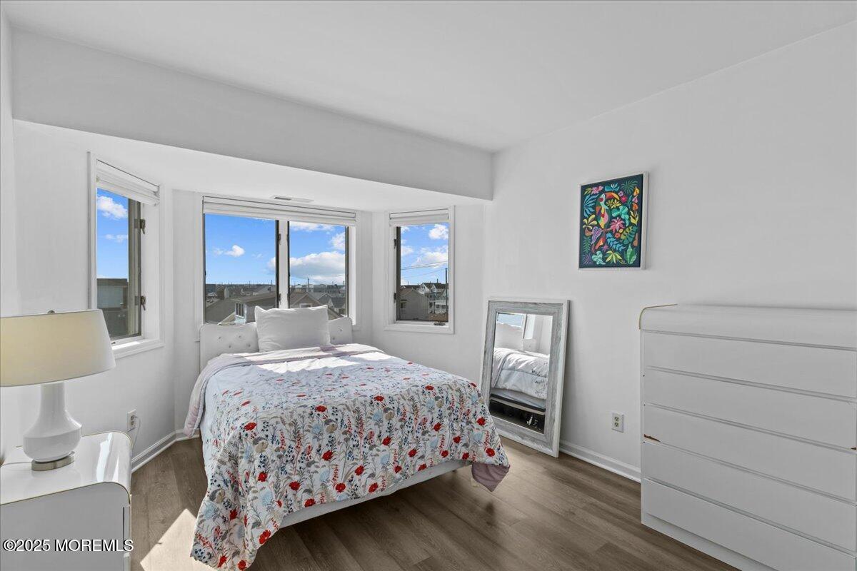 30 Dune Terrace Seaside Heights, NJ 08751 - Photo 21 of 42 a bedroom with a bed and wooden floor