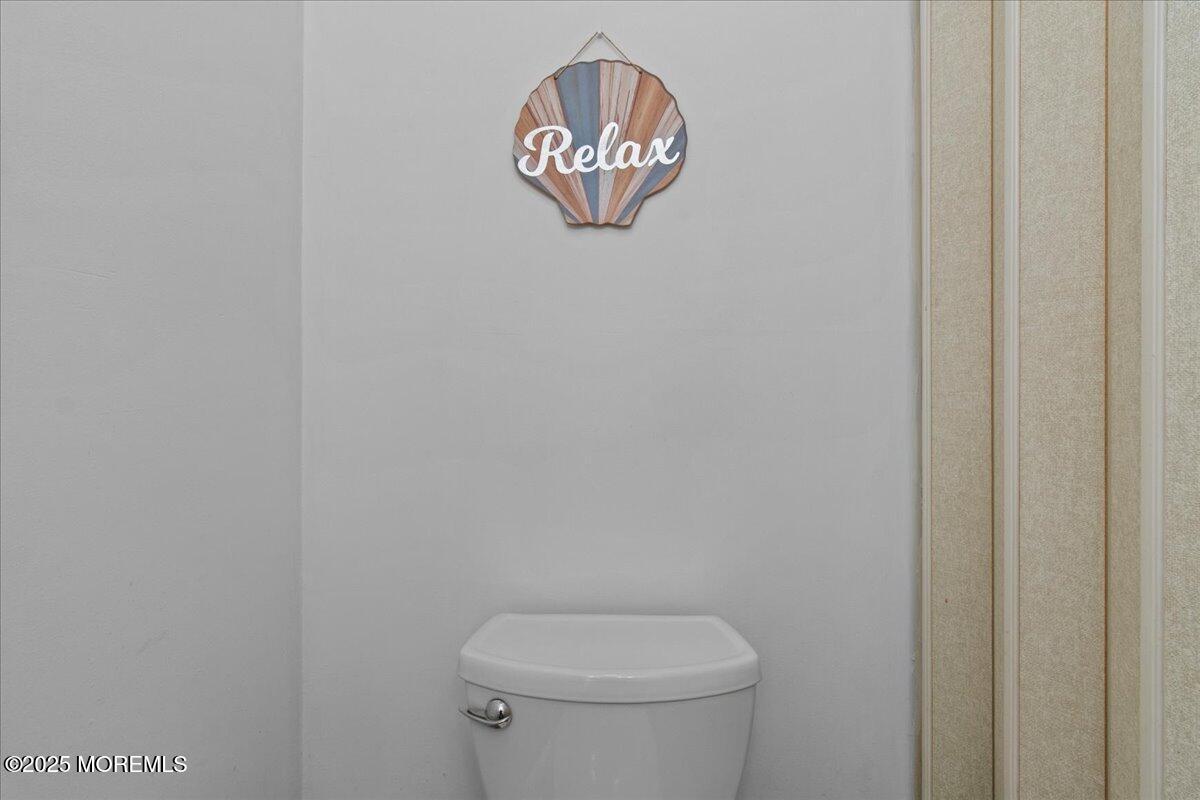 30 Dune Terrace Seaside Heights, NJ 08751 - Photo 24 of 42 a bathroom with a toilet and a sink