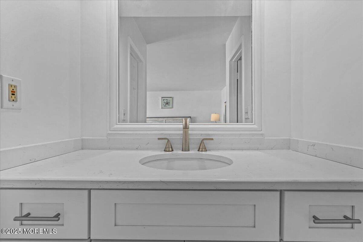30 Dune Terrace Seaside Heights, NJ 08751 - Photo 31 of 42 a bathroom with a sink and a mirror