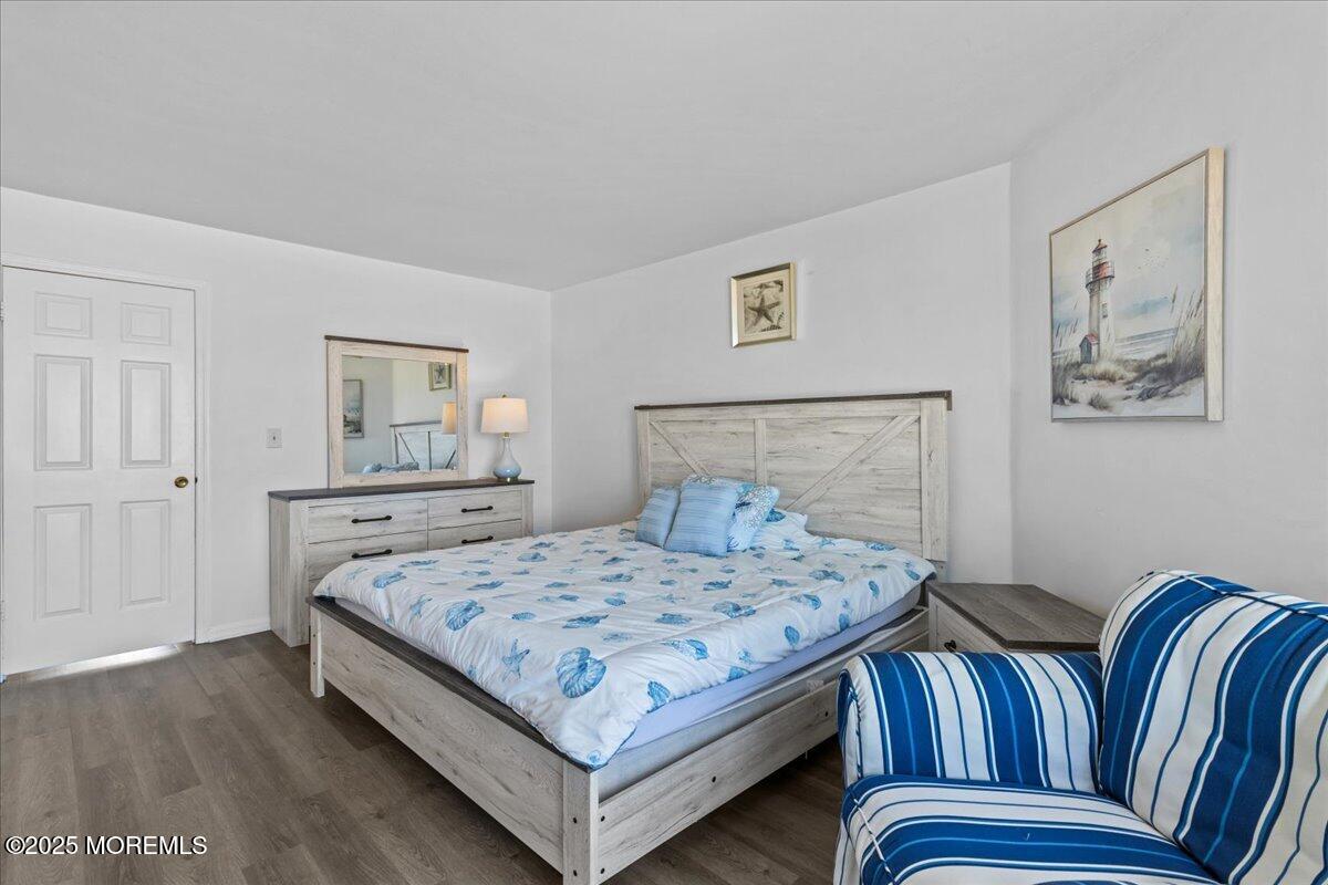 30 Dune Terrace Seaside Heights, NJ 08751 - Photo 35 of 42 a bedroom with a bed and wooden floor