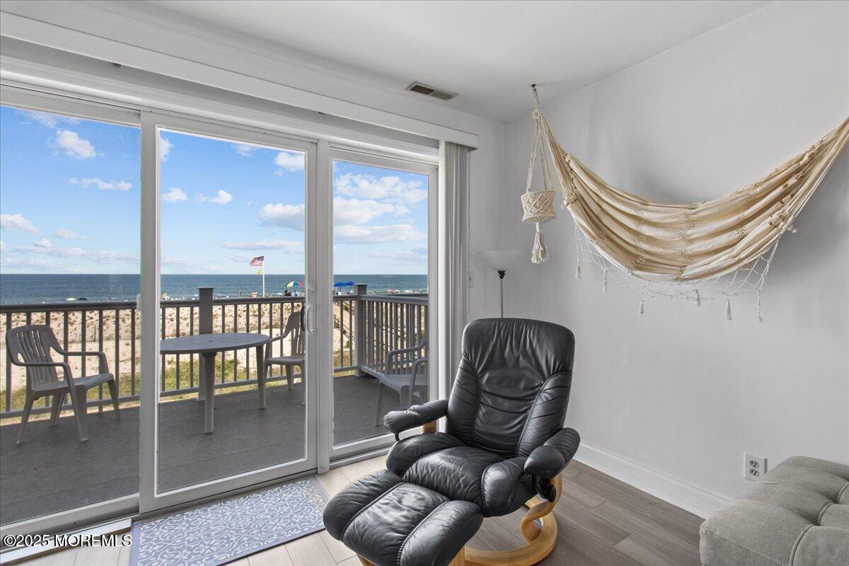 30 Dune Terrace Seaside Heights, NJ 08751 - Photo 4 of 42 a living room with furniture and a large window
