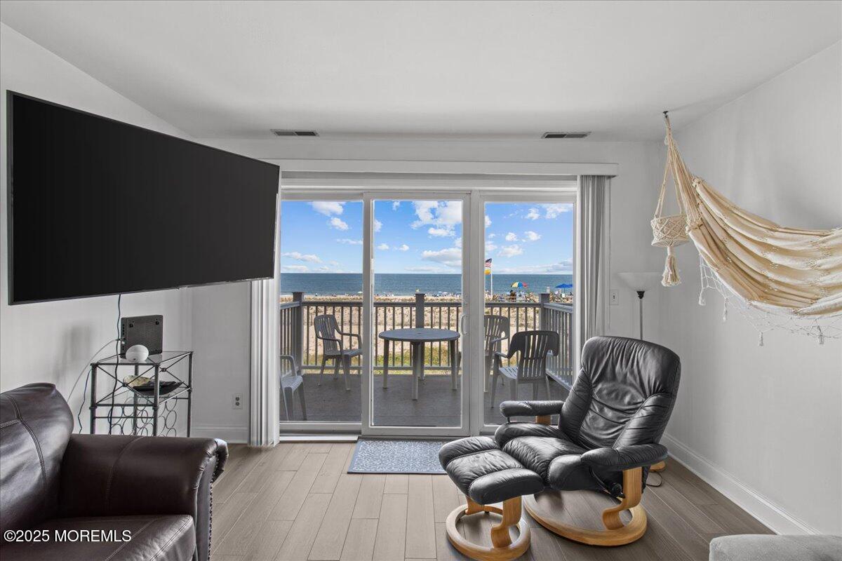 30 Dune Terrace Seaside Heights, NJ 08751 - Photo 5 of 42 a living room with furniture a window and a flat screen tv
