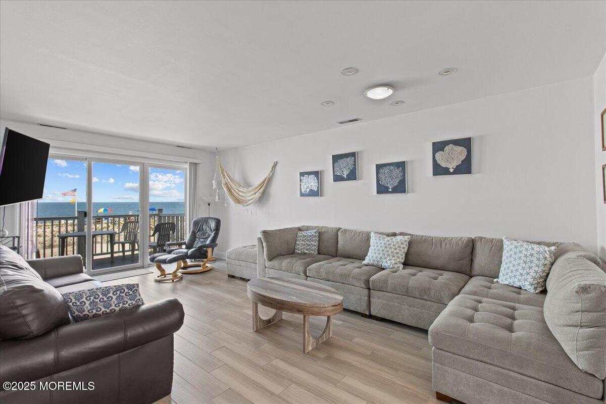 30 Dune Terrace Seaside Heights, NJ 08751 - Photo 6 of 42 a living room with furniture and a couch