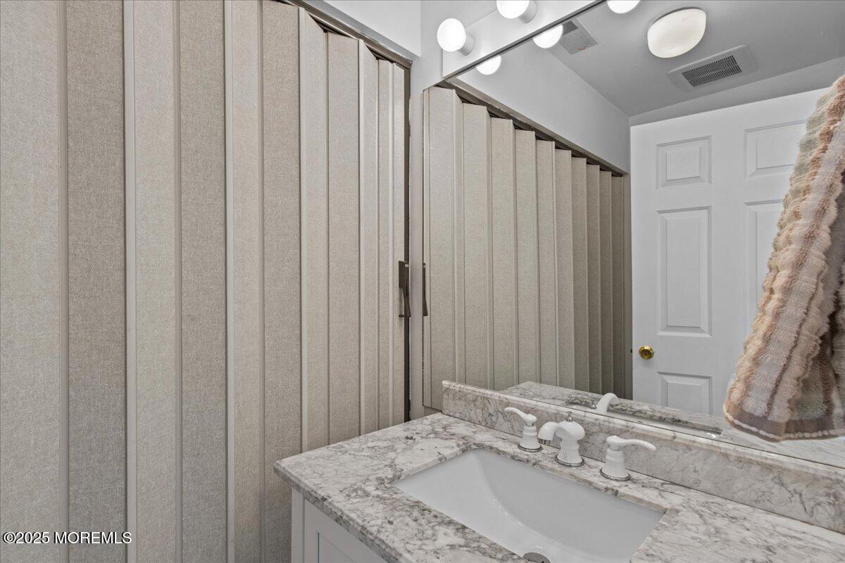 30 Dune Terrace Seaside Heights, NJ 08751 - Photo 7 of 42 a bathroom with a granite countertop sink and curtain
