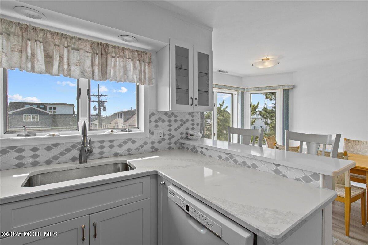 30 Dune Terrace Seaside Heights, NJ 08751 - Photo 10 of 42 a bathroom with a sink and a mirror