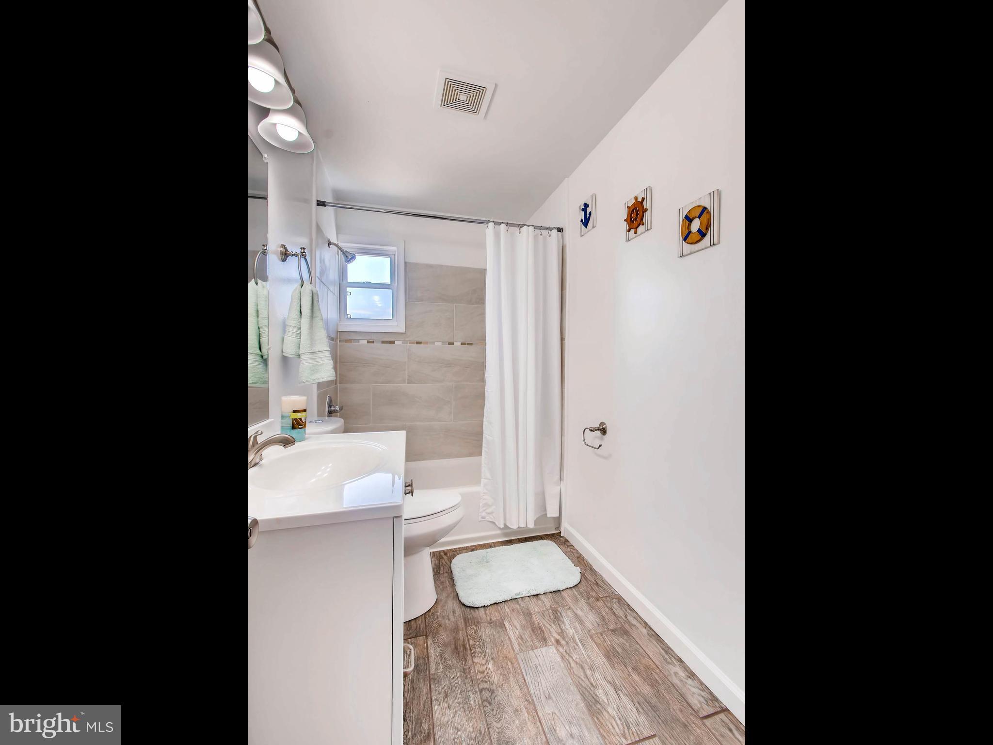 1722 Melbourne Road Baltimore, MD 21222 - Photo 14 of 21 Upper Level Custom Bath with Ceramic Tile